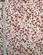 Tissu au mètre réf. 350212 voile de polyester imprimé fleurs coloris framboise