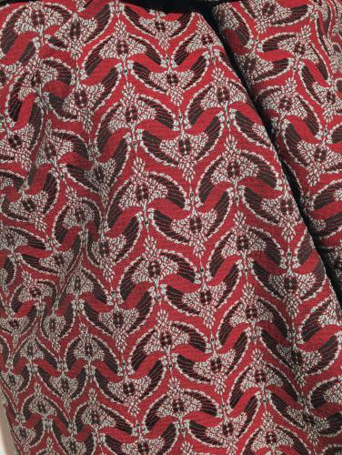 Tissu au mètre réf.  210267 Tissage jacquard en polyester et acrylique, fond carmin et motifs turquoise et noir